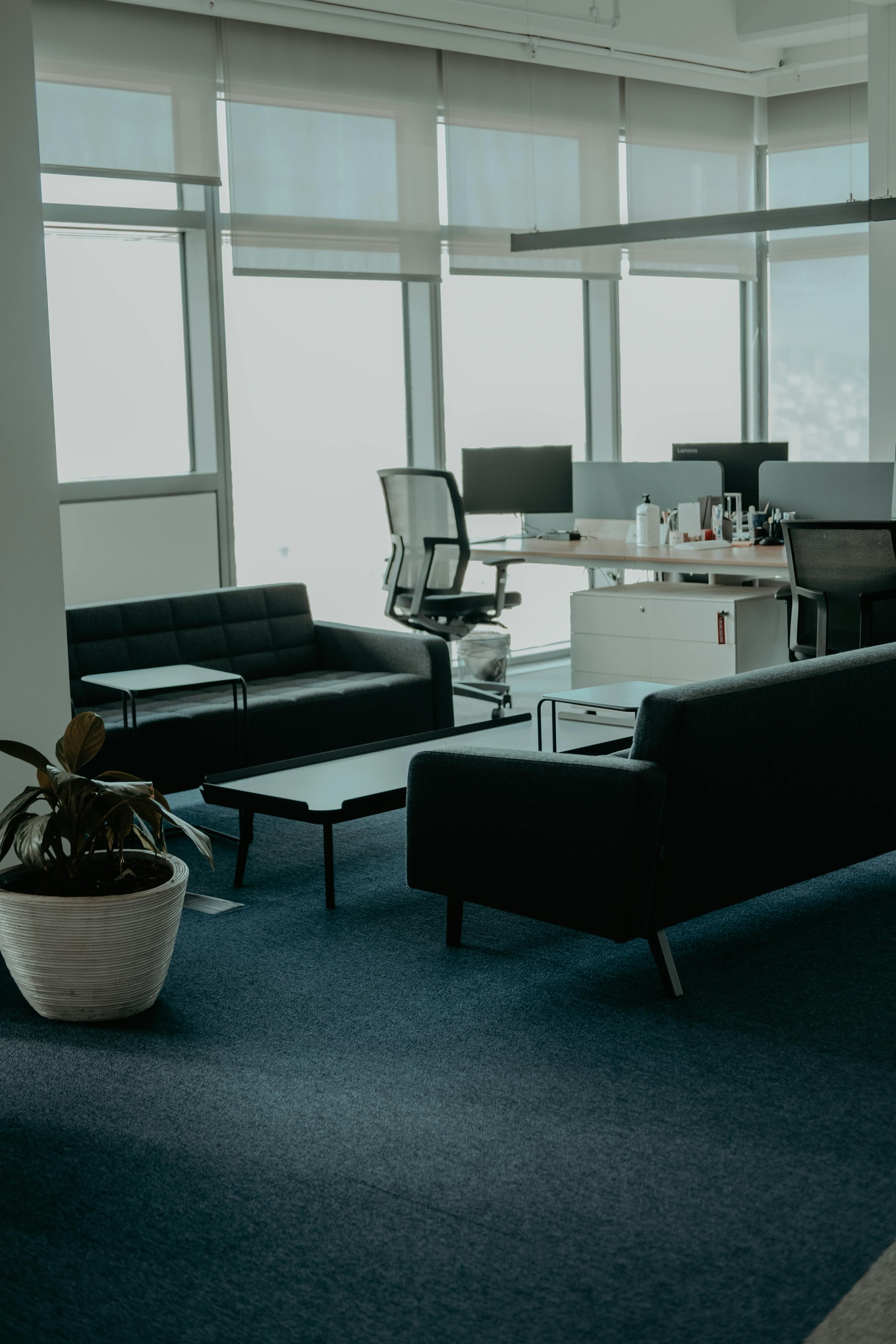 Modern office interior with tall glass windows